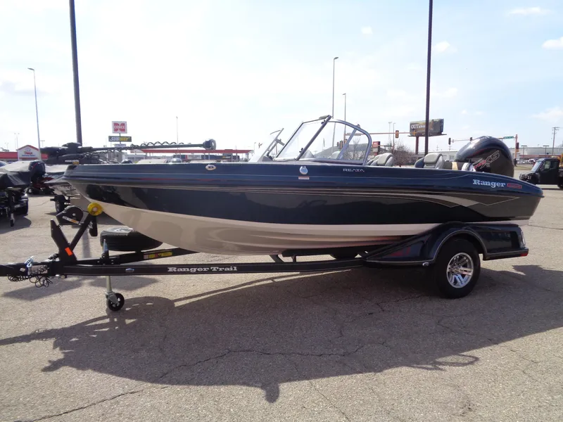 Slide: The Image of 2024 Ranger 1850MS boat on trailer, parked outdoors, side view. - 3
