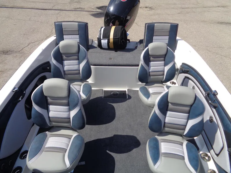 Slide: The Image of 2024 Ranger 1850MS boat interior with five cushioned seats and motor. - 8
