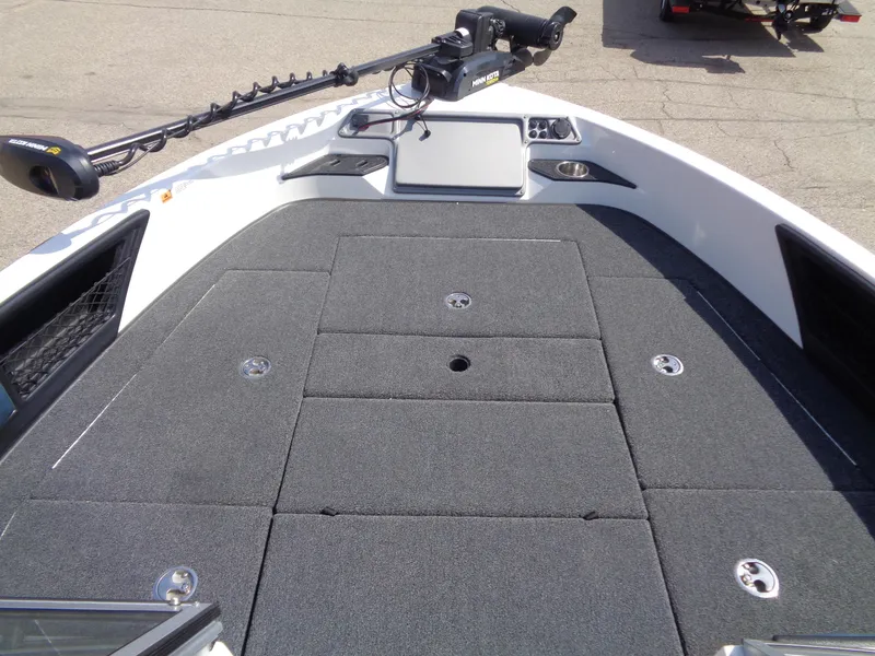 Slide: The Image of 2024 Ranger 1850MS boat deck with trolling motor and storage compartments. - 9