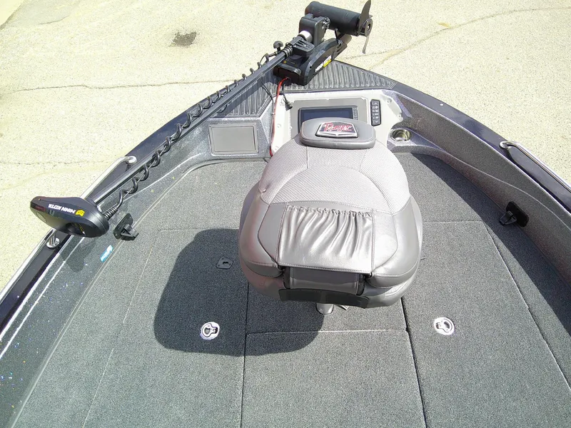 Slide: The Image of 2024 Ranger 620FS Pro boat interior with seating and trolling motor. - 12
