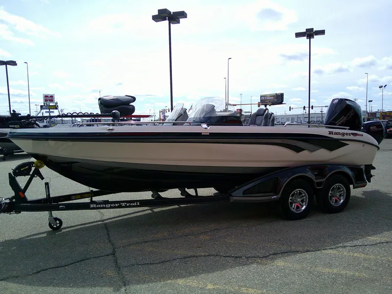 Slide: The Image of 2024 Ranger 620FS Pro fishing boat on trailer in parking lot. - 3