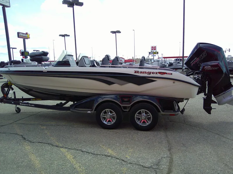 Slide: The Image of 2024 Ranger 620FS Pro boat on trailer in parking lot, side view. - 5