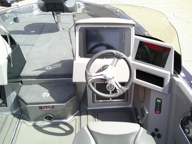 Slide: The Image of 2024 Ranger 620FS Pro boat dashboard with steering wheel and electronic display. - 9