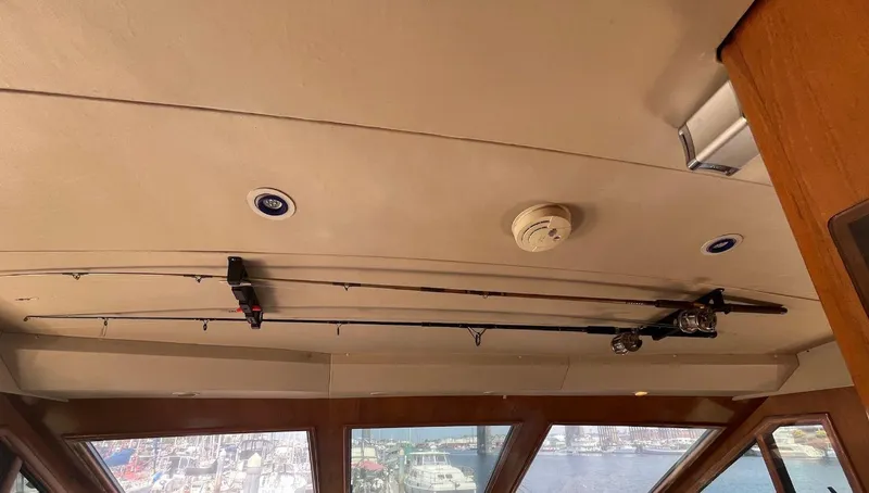 Slide: The Image of Ceiling of 1993 Kha Shing Motoryacht with fishing rods and smoke detector. - 22