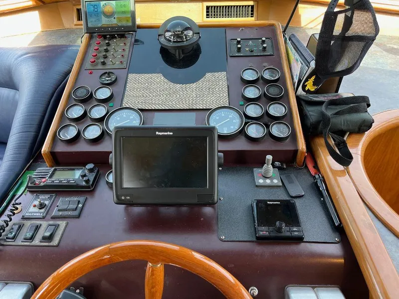 Slide: The Image of Control panel of a 1993 Kha Shing Motoryacht with navigation instruments and gauges. - 24
