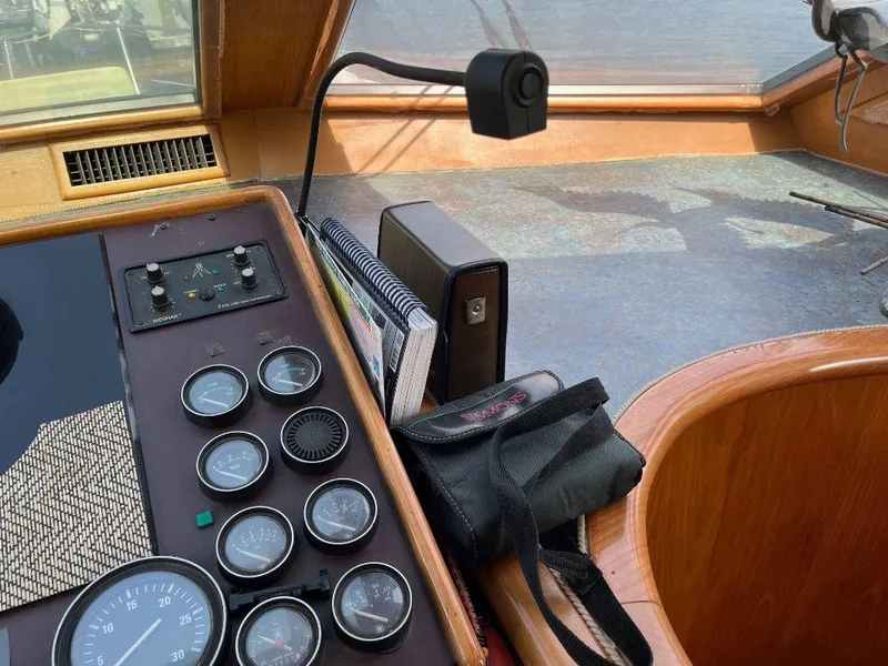 Slide: The Image of Control panel of a 1993 Kha Shing Motoryacht with gauges and navigation equipment. - 25