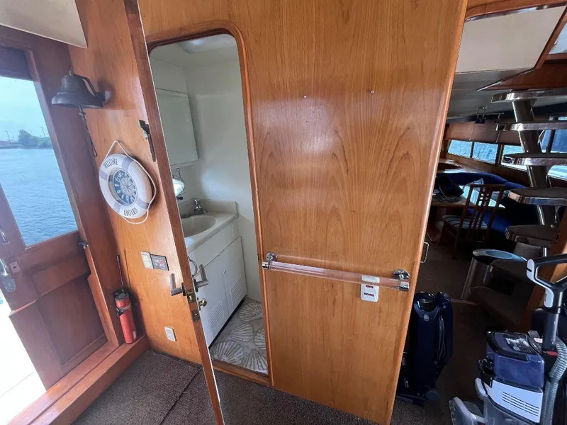 Slide: The Image of Interior of 1993 Kha Shing Motoryacht with wooden paneling and compact bathroom. - 27