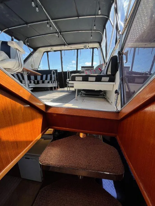 Slide: The Image of Interior view of 1993 Kha Shing Motoryacht with seating and wooden stairs. - 31