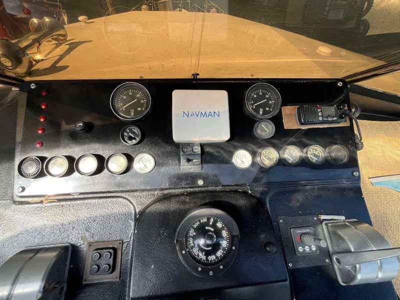 Slide: The Image of Control panel of a 1993 Kha Shing Motoryacht with gauges and navigation equipment. - 40