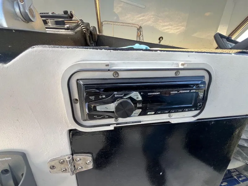 Slide: The Image of 1993 Kha Shing Motoryacht dashboard with modern stereo system installed. - 46