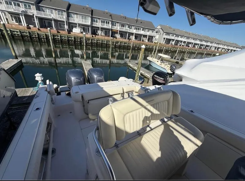 Slide: The Image of 2005 Grady-White Release 283 boat docked near waterfront homes. - 5