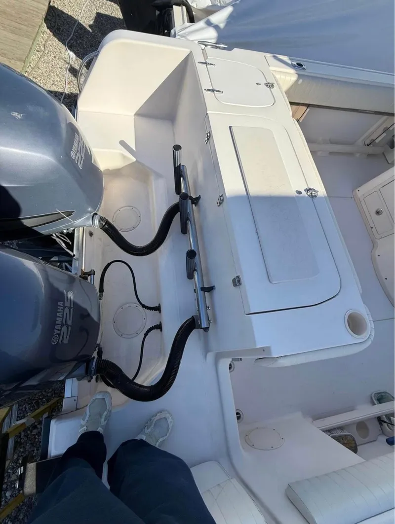 Slide: The Image of 2005 Grady-White Release 283 boat deck with dual outboard engines. - 9