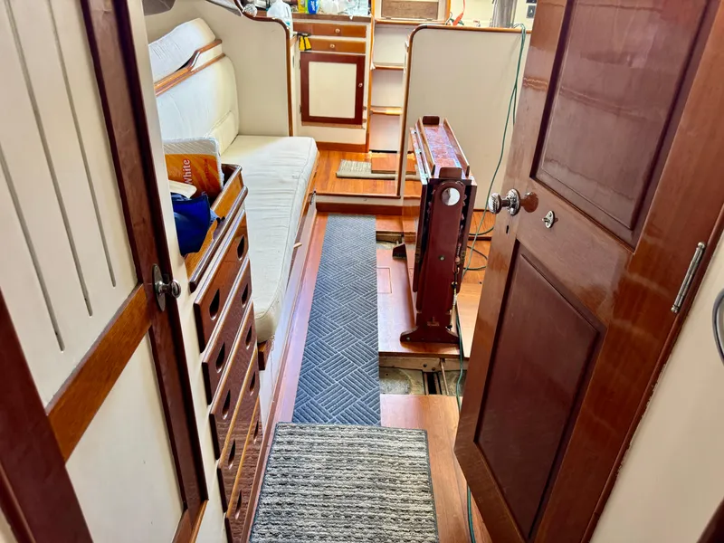 Slide: The Image of Wooden drawers inside a 1956 Aage Nielsen 50' Yawl, showcasing classic nautical craftsmanship. - 17