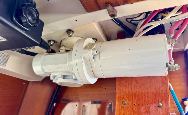 Slide: The Image of Electrical component inside a 1956 Aage Nielsen 50' Yawl, featuring wiring and wooden paneling. - 24