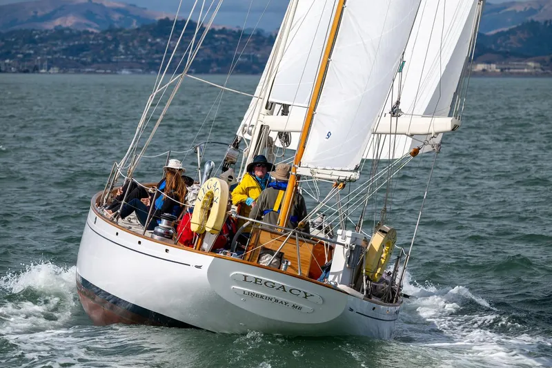 Slide: The Image of Aage Nielsen 1956 50' Ketch sailing on open water with crew onboard. - 5