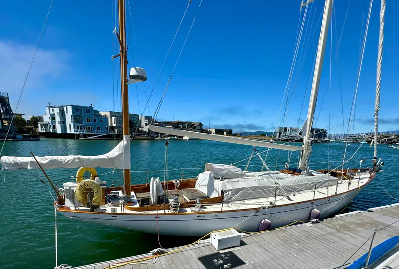 Slide: The Image of Aage Nielsen 50' Ketch, 1956, docked in a sunny marina. - 8