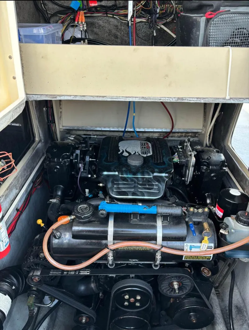 Slide: The Image of 1998 Albemarle 242 Center Console engine compartment with visible wiring and components. - 7