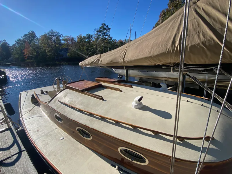 Slide: The Image of 37ft Custom Catboat Yacht, Barnegat Bay A-Cat, docked on a sunny day, 2012 model. - 15