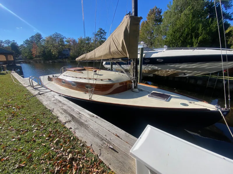 Slide: The Image of 37ft Custom Catboat Yacht docked by a scenic riverside, 2012 Barnegat Bay A-Cat model. - 25