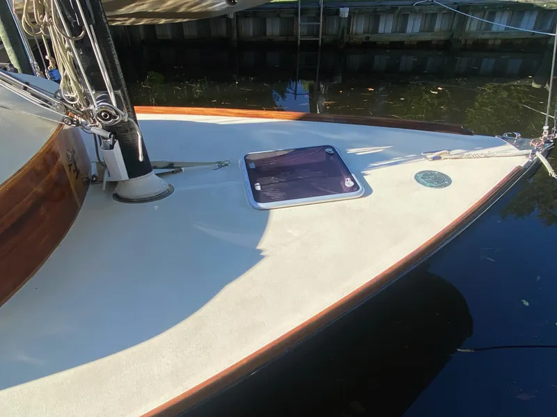 Slide: The Image of 37ft Catboat Yacht Adaptation, Barnegat Bay A-Cat, docked, showing deck and hatch, 2012 model. - 27