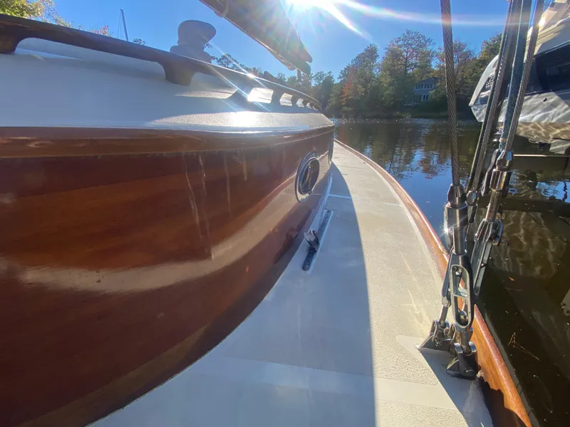 Slide: The Image of 37ft Catboat Yacht on water, sunny day, wooden deck, Barnegat Bay A-Cat, 2012 model. - 29