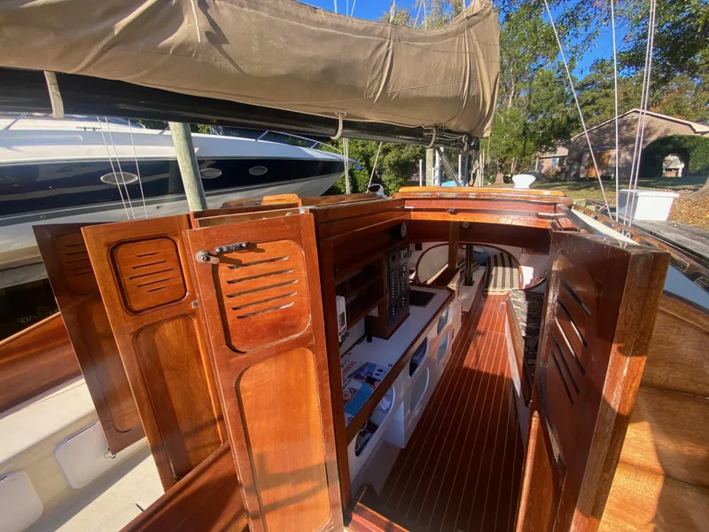 Slide: The Image of Interior view of a 2012 Custom 37ft Catboat Yacht, featuring wooden cabinetry and sleek design. - 32
