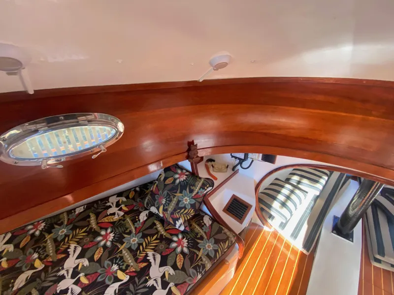 Slide: The Image of Luxurious 2012 custom 37ft catboat yacht interior with floral upholstery and wooden finishes. - 48