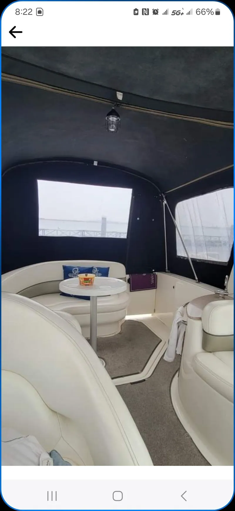 Slide: The Image of Interior of a 2006 Sea Ray 260 Sundancer boat with seating and table. - 10