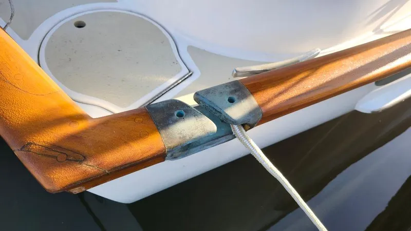 Slide: The Image of Close-up of Cabo Rico 34 sailboat's wooden rail with rope, 1989 model. - 13