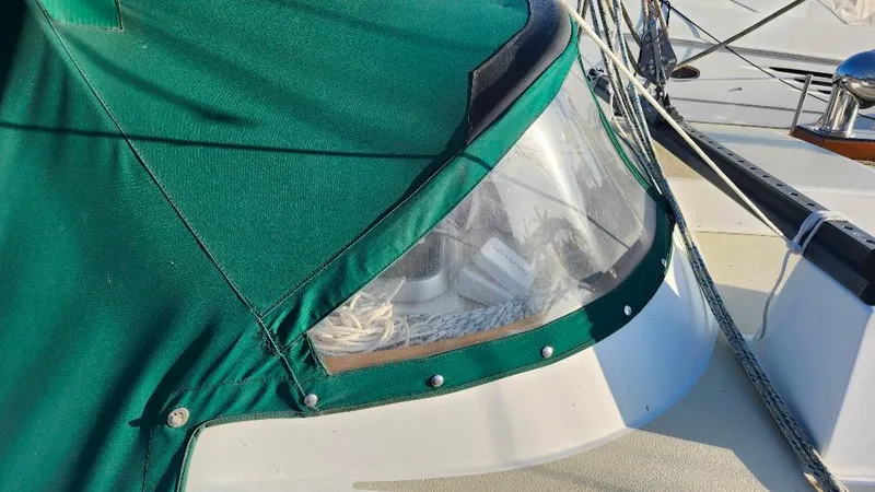 Slide: The Image of Green canvas cover on 1989 Cabo Rico 34 sailboat deck, with clear window. - 18