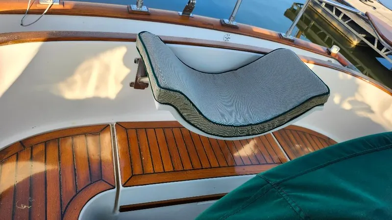Slide: The Image of Cabo Rico 34 sailboat cockpit with cushioned seat and wooden flooring, 1989 model. - 20
