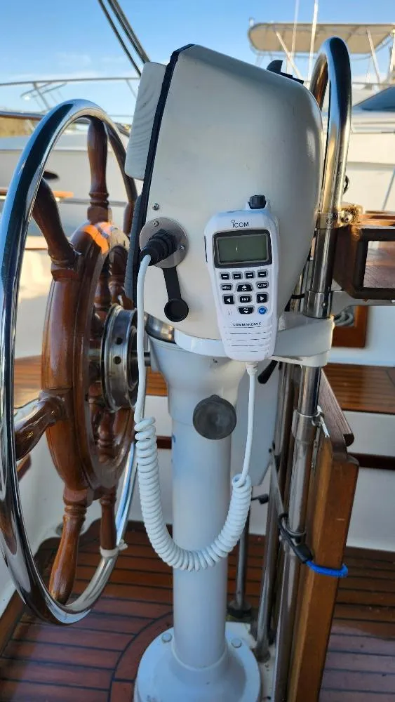 Slide: The Image of Steering wheel and controls of a 1989 Cabo Rico 34 sailboat. - 24