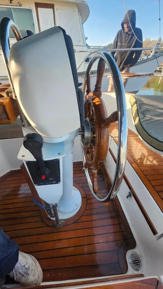 Slide: The Image of Cabo Rico 34 sailboat helm with wooden wheel, 1989 model. - 25
