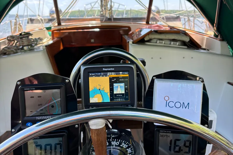 Slide: The Image of Cockpit of 1989 Cabo Rico 34 sailboat with navigation instruments and steering wheel. - 28