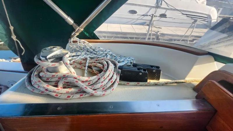 Slide: The Image of Cabo Rico 34 sailboat deck with winch and coiled ropes, 1989 model. - 33