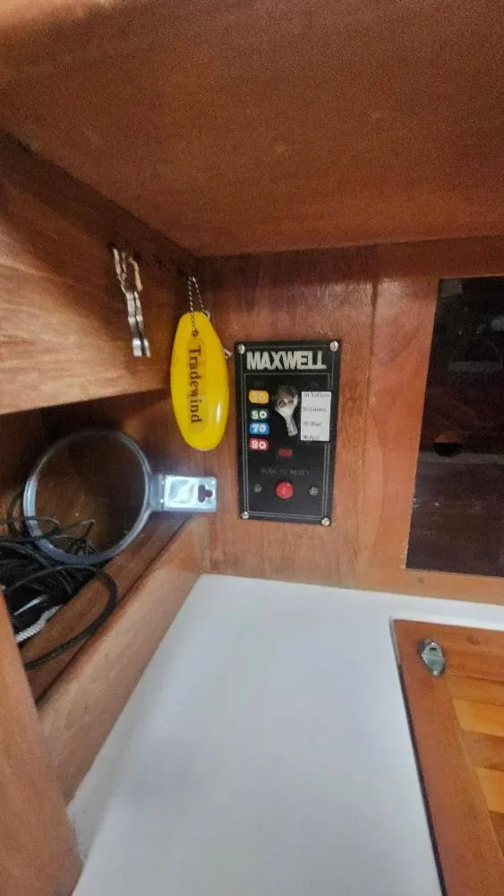 Slide: The Image of Control panel inside 1989 Cabo Rico 34 sailboat with Maxwell equipment and accessories. - 39