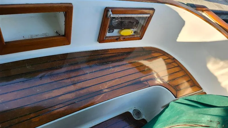 Slide: The Image of Teak deck of 1989 Cabo Rico 34 sailboat with wooden trim and control panel. - 8