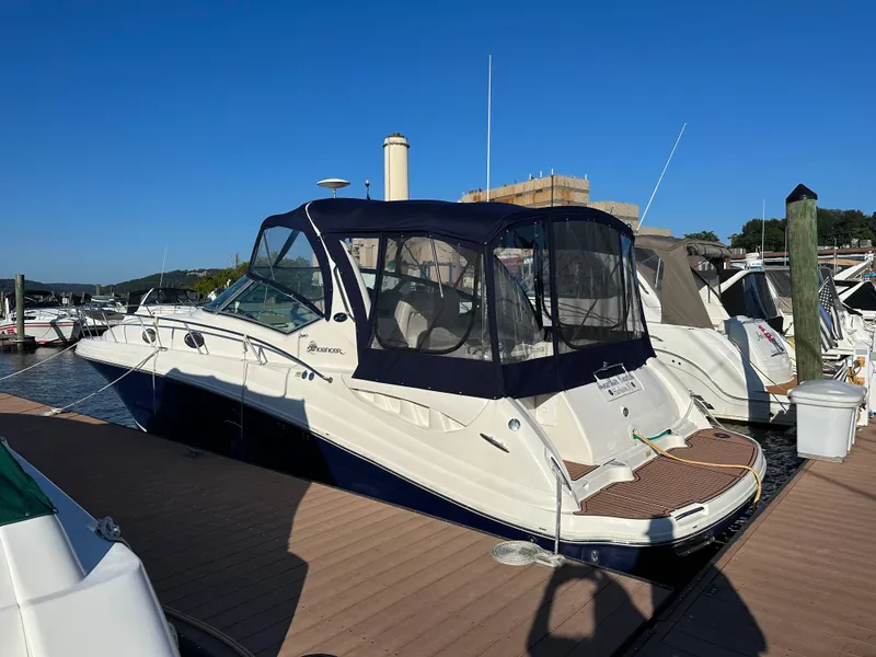 Slide: The Image of 2005 Sea Ray 340 Sundancer docked at marina under clear blue sky. - 0
