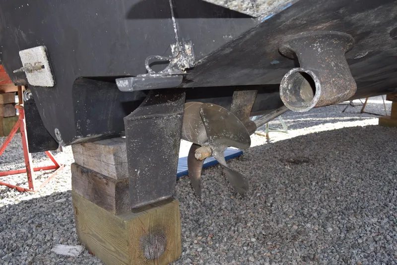 Slide: The Image of 2005 Sea Ray 340 Sundancer propeller and hull on wooden blocks. - 12