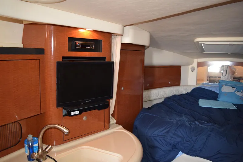 Slide: The Image of Interior of 2005 Sea Ray 340 Sundancer with TV, sink, and cozy bed. - 17