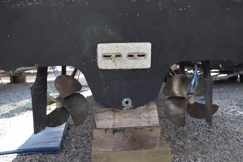 Slide: The Image of 2005 Sea Ray 340 Sundancer propellers and hull on wooden blocks. - 18