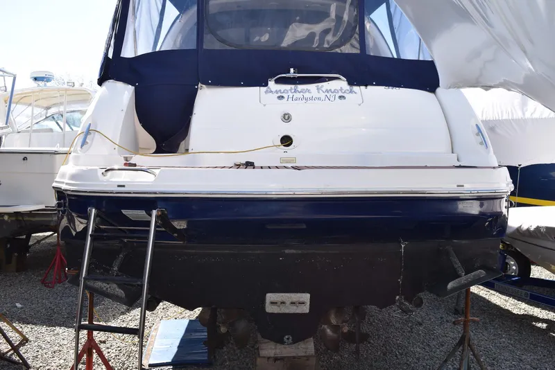 Slide: The Image of 2005 Sea Ray 340 Sundancer boat on dry dock, rear view with ladder access. - 22
