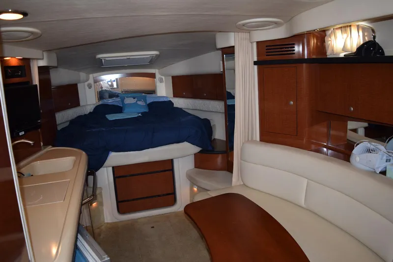 Slide: The Image of Interior of 2005 Sea Ray 340 Sundancer yacht with cozy cabin and seating area. - 26