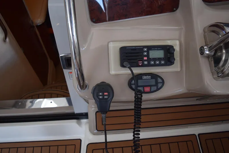 Slide: The Image of Control panel of a 2005 Sea Ray 340 Sundancer boat with radio and microphone. - 30