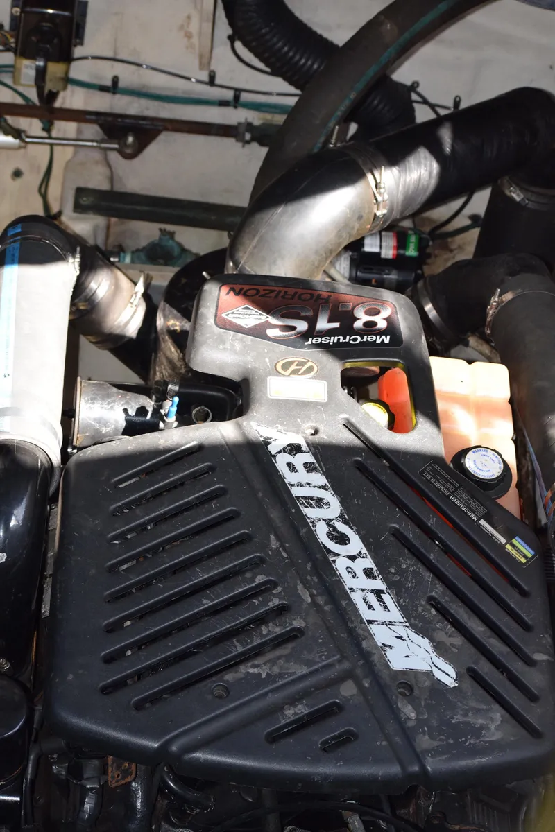 Slide: The Image of Engine compartment of a 2005 Sea Ray 340 Sundancer with MerCruiser components. - 33