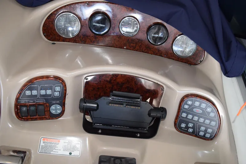 Slide: The Image of Control panel of a 2005 Sea Ray 340 Sundancer boat with gauges and switches. - 41