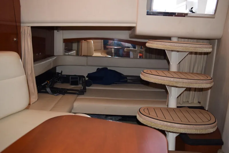 Slide: The Image of Interior of 2005 Sea Ray 340 Sundancer yacht with seating and spiral staircase. - 6
