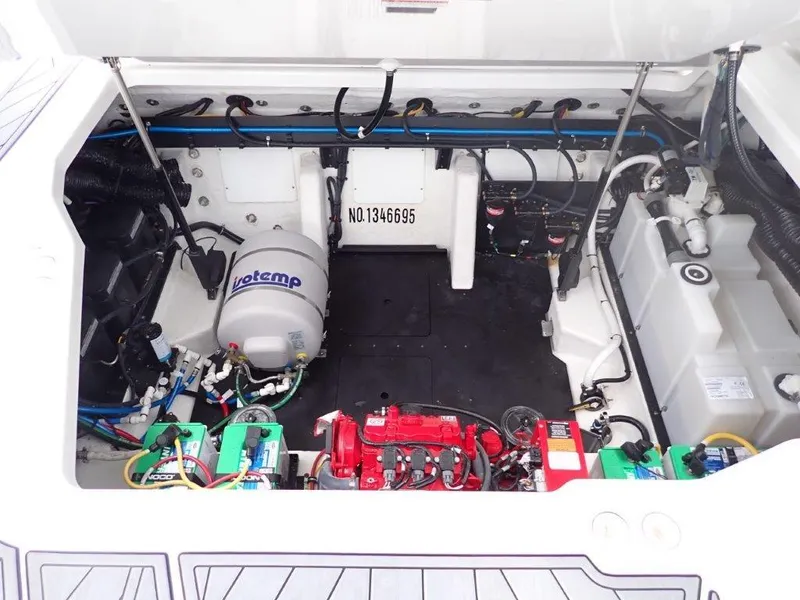 Slide: The Image of Engine compartment of 2023 Monterey 385 Super Sport boat, showcasing mechanical components and wiring. - 12