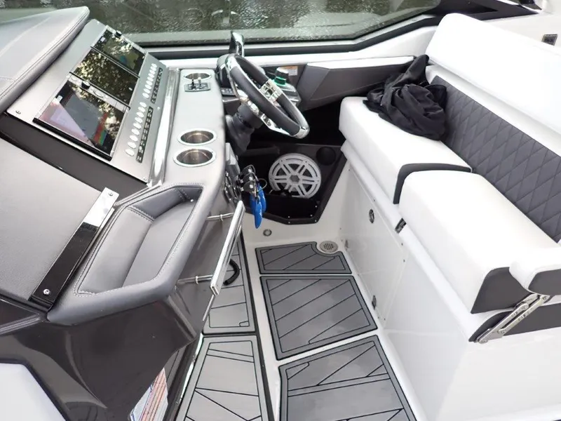 Slide: The Image of 2023 Monterey 385 Super Sport cockpit with modern dashboard and seating. - 22