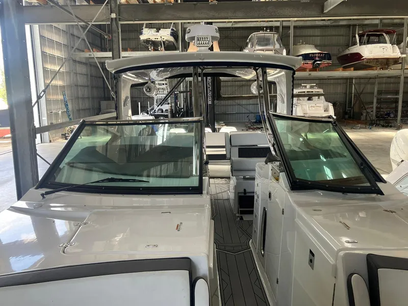 Slide: The Image of 2023 Monterey 385 Super Sport boat in a storage facility, showcasing sleek design and modern features. - 35